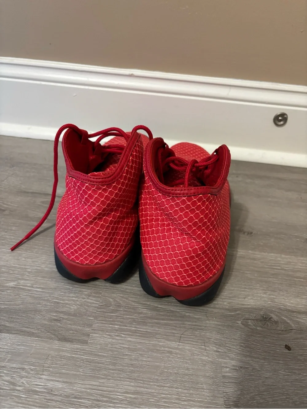 Men’s red high top Jordan sneakers